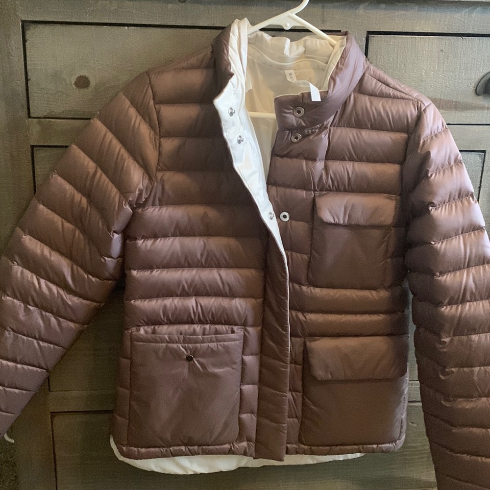 Pulse reversible down jacket with detached hood.